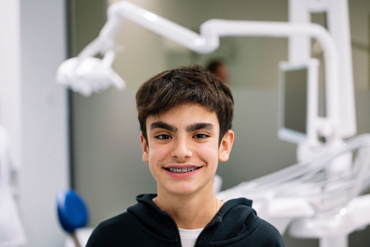 Teen with braces at dental office